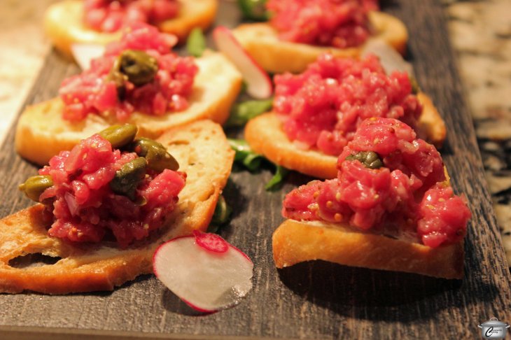 Steak tartare with minced ribeye, Dijon, shallot, chive and lemon.