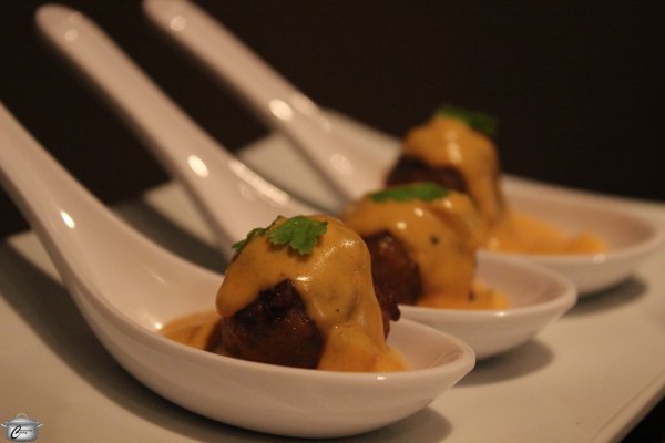 Meatballs topped with a flavourful cream sauce make for an attractive and delicious Russian-inspired appetizer.