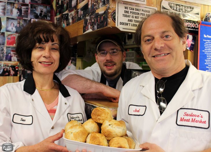 Longtime Saslove's employee Sue Saikaley, butcher Connor Wells and owner Joel Diener with a tray of the shop's fabulous knishes.