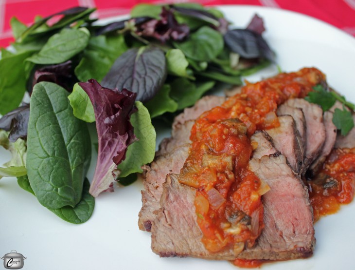 Perfectly seared baseball cut top sirloin steak is finished in the oven and topped with a pizza-inspired sauce for a fresh new presentation.