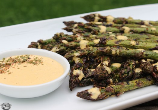 Grilling is an easy way to prepare asparagus and this creamy harissa sauce adds a ton of flavour