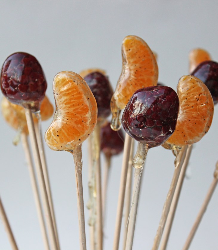 A simple hard-crack sugar syrup is the perfect way to coat pieces of fruit to turn them into lollipops!