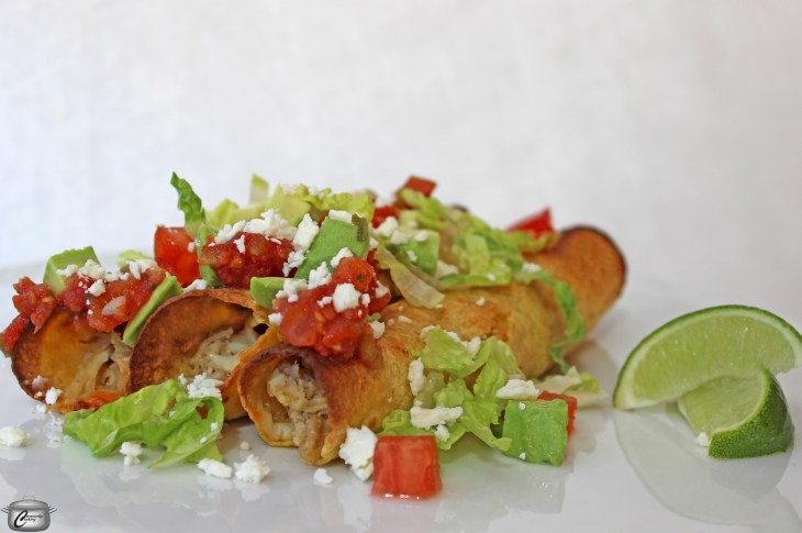 taquitos are small tortillas rolled around a filling of chicken and cheese then baked until crispy